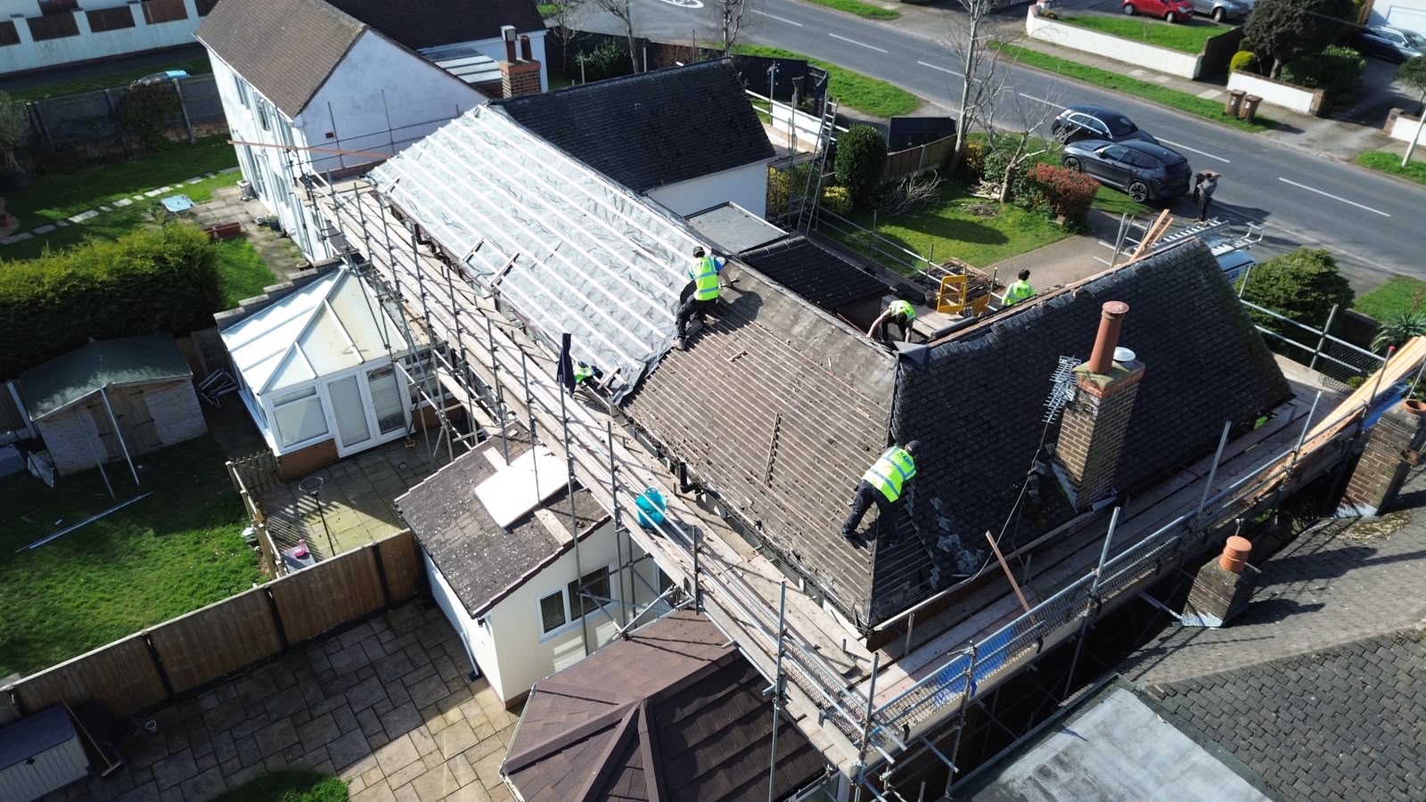 RTC Roofing team stripping the old covering during a full re-roof, temporary weathering in place, Wirral