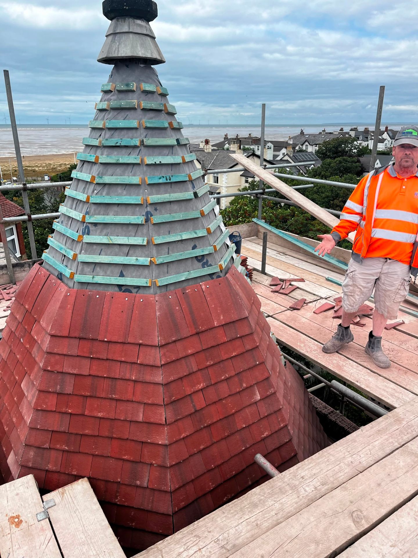 Heritage conical tower re-roof in progress with new battens and salvaged clay tiles, RTC Roofing Hoylake